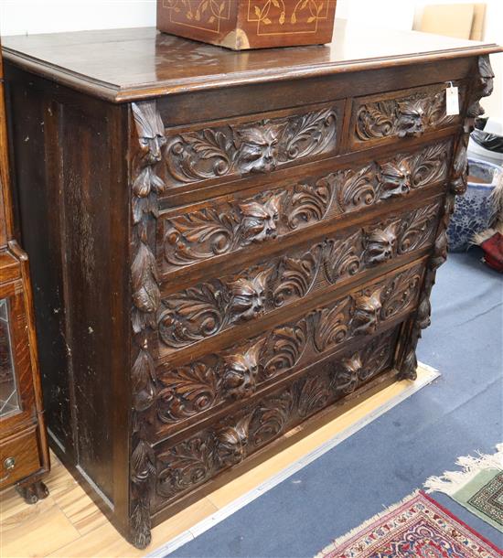 A 19th century Flemish style carved oak chest W.125cm